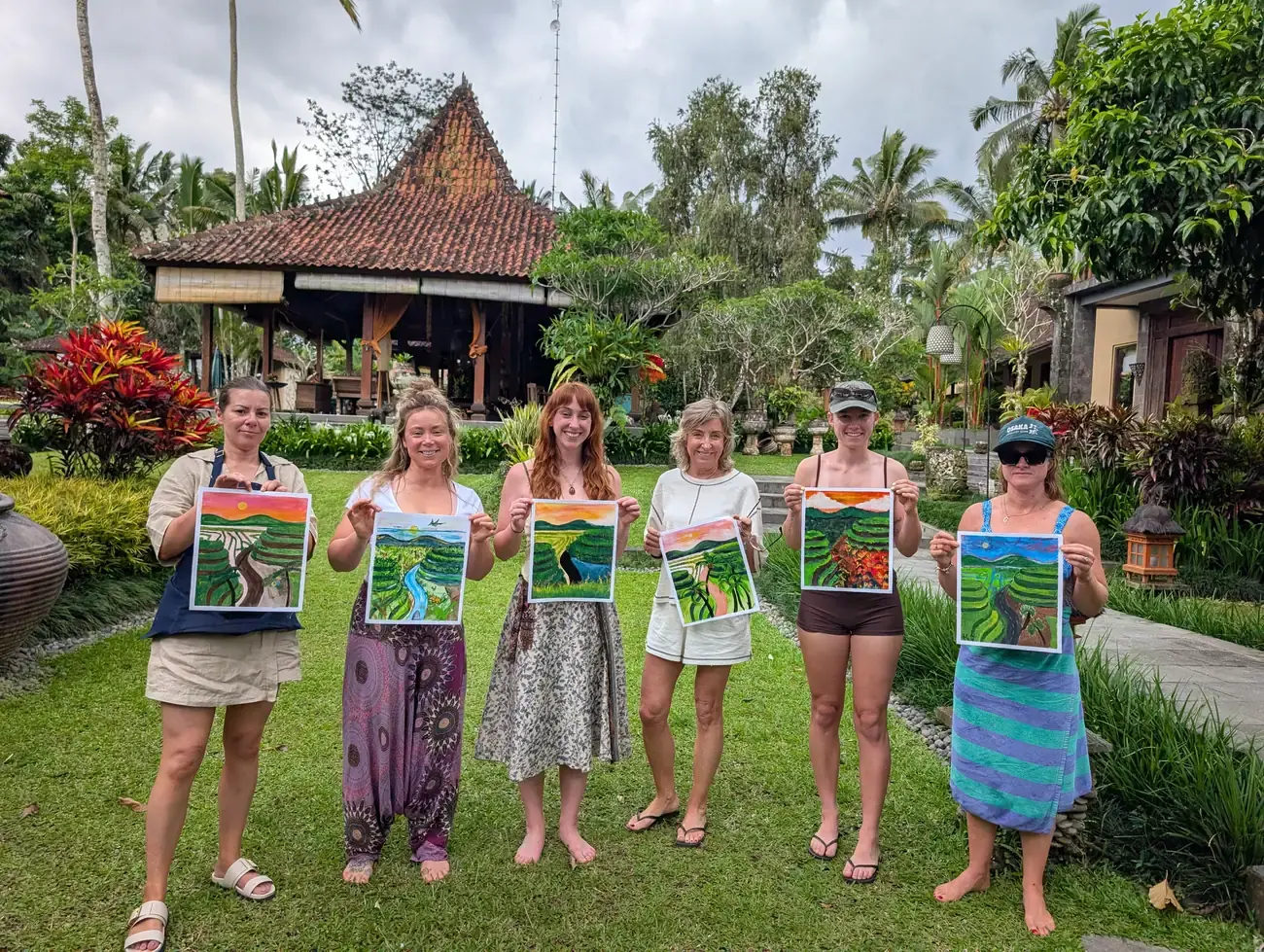Guests painting together at a private picnic paint and sip event in Bali