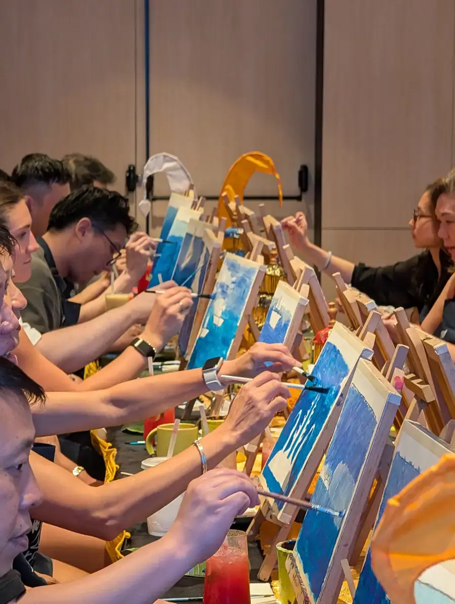 Friends painting together at a private Paint and Sip event in Bali