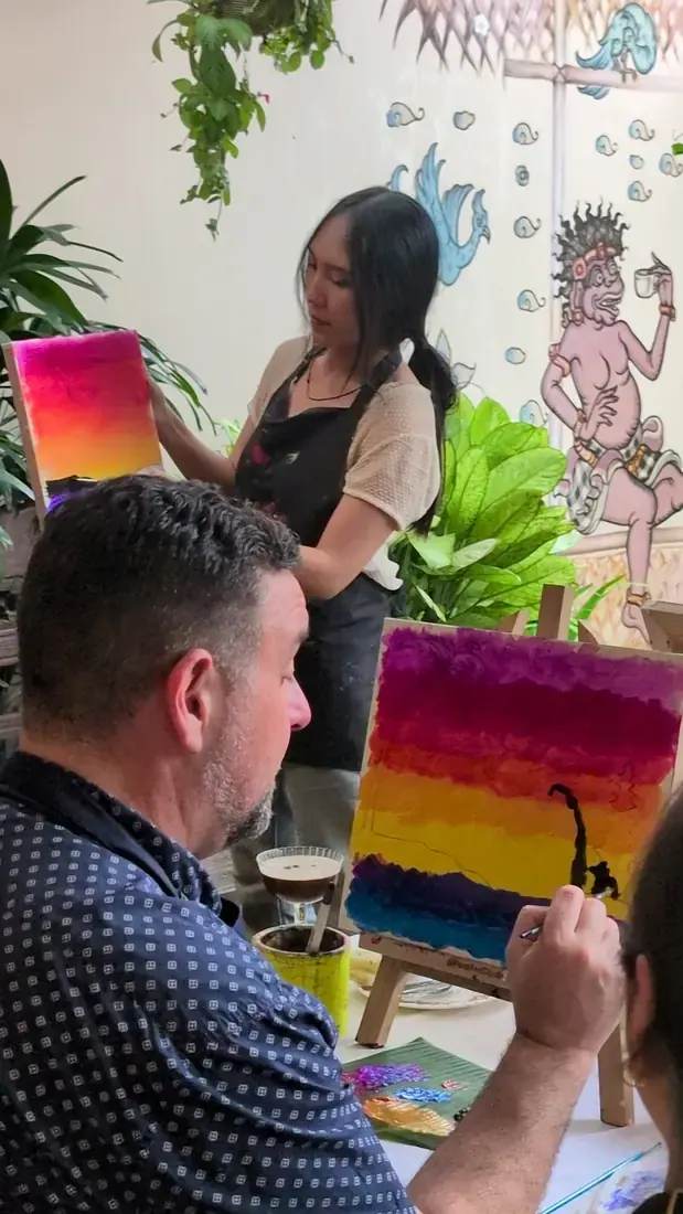 Creative private event with painting materials and guests