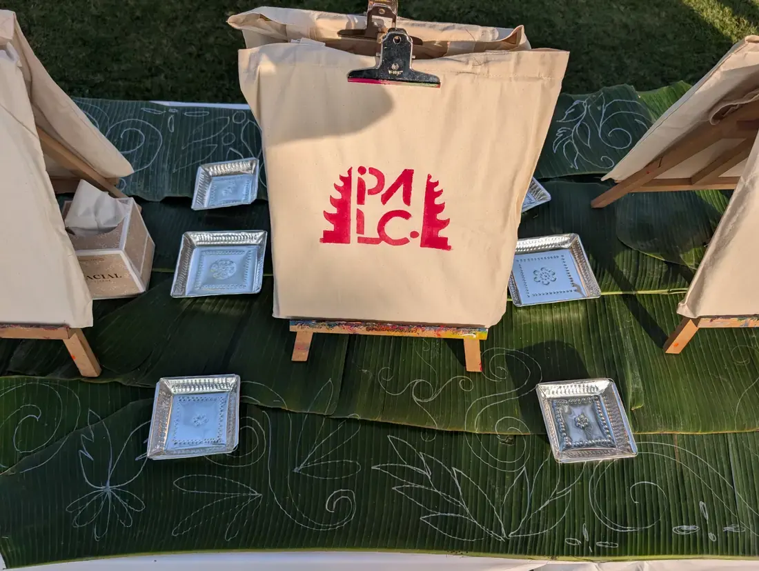 Friends painting together at a Bali private art event