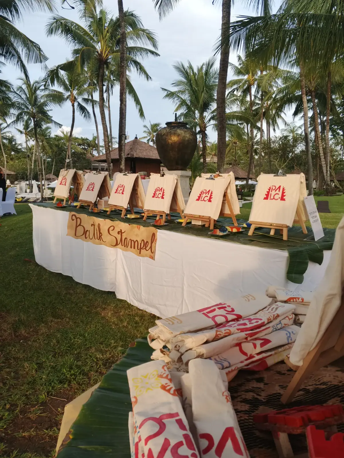 Batik Stampel Booth setup with canvas tote bags at a Bali event
